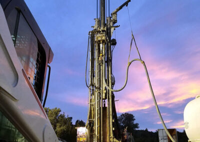 A T130 rotary drill rig drilling a water well.
