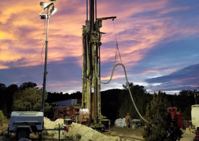 Mineral exploration drilling at sunrise with a Schramm T130XD drill rig.